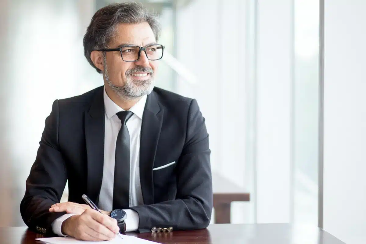 Experienced tax attorney in Maryland sitting at a desk, reviewing legal documents and providing expert tax advice.