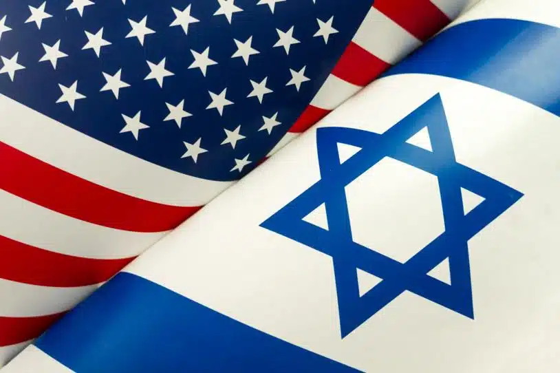 Folded American and Israeli flags side by side.
